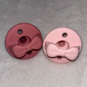 (2 for $10) Itzy Ritzy Bow Silicone Pacifiers - Pink and Rose